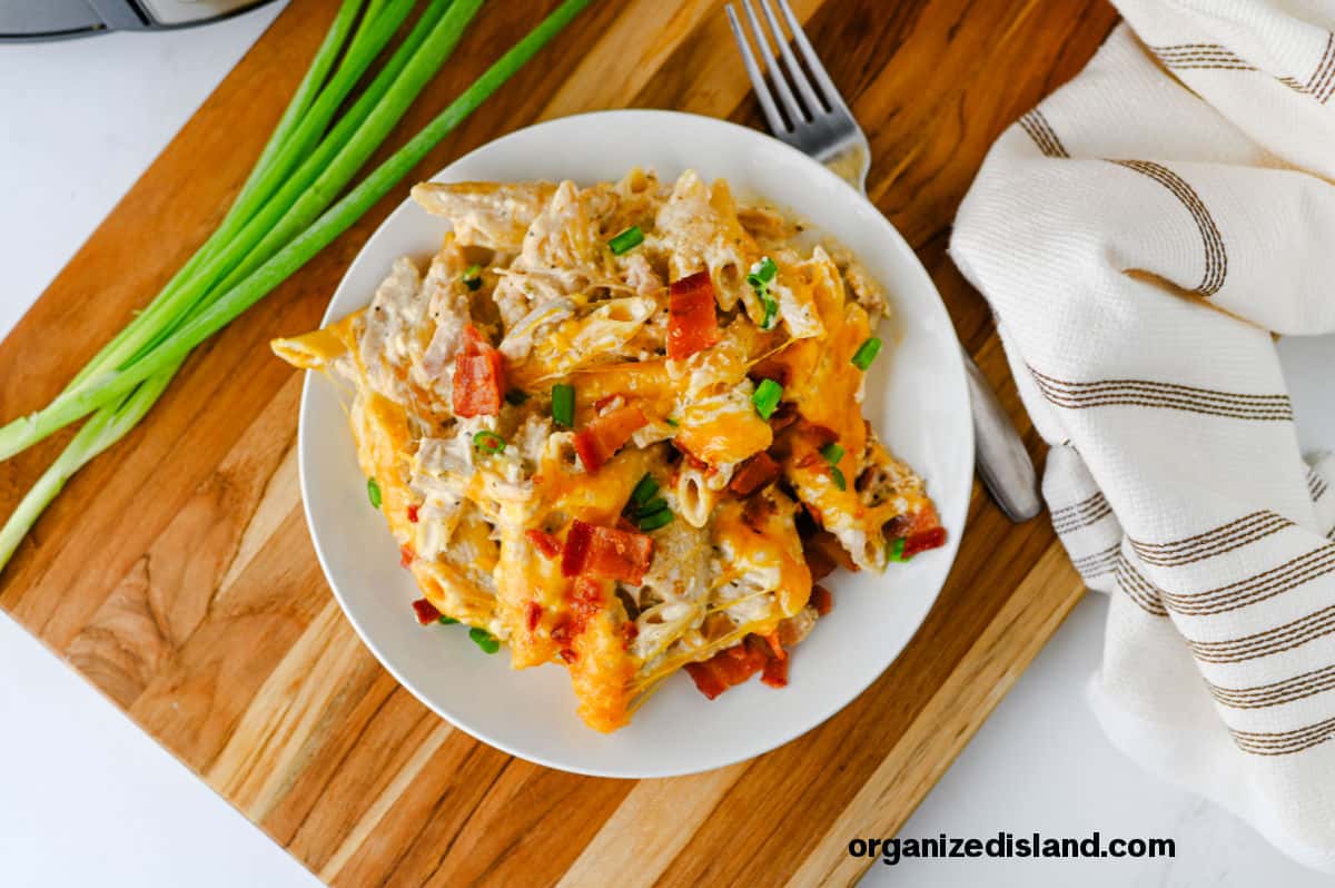 Best Crock Pot Crack Chicken Pasta on plate with fork.