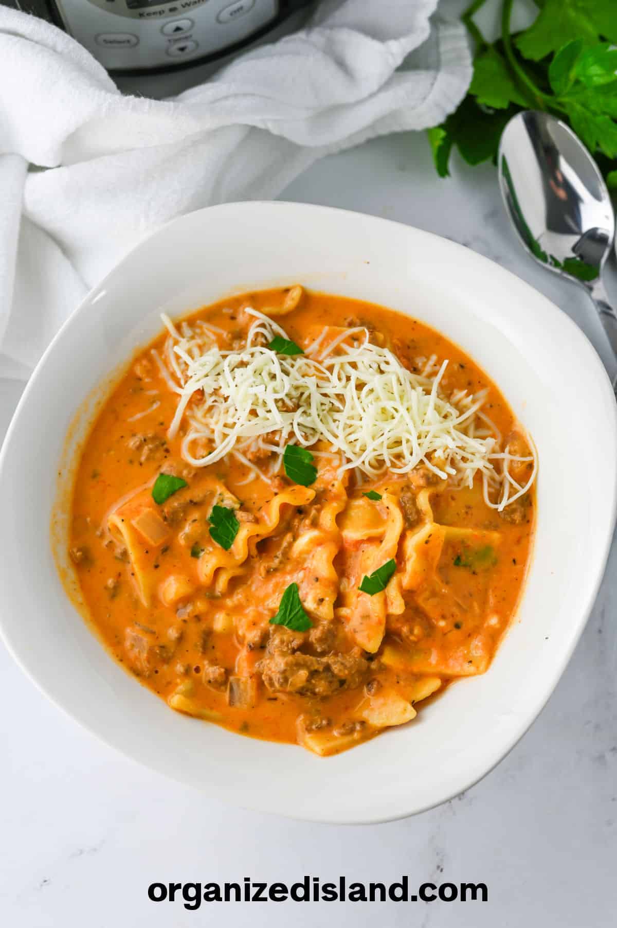 Easy Crockpot Lasagna Soup or Slow Cooker Lasagna Soup in bowl with spoon.