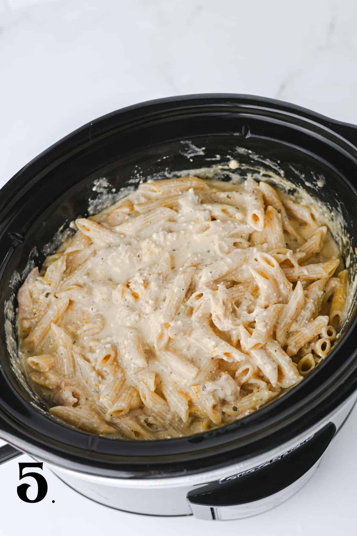 How to Make Crockpot Crack Chicken Pasta Step 5 adding cheese.