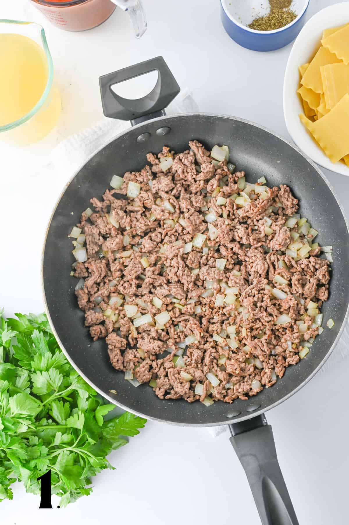 How to Make Crockpot Lasagna Soup Step 1 - browning ground beef and onions in skillet.