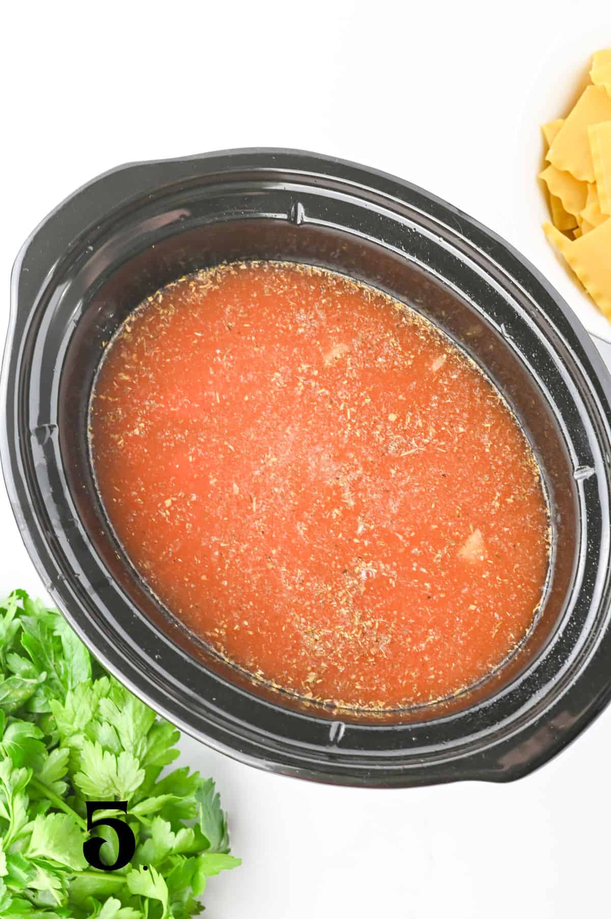 How to Make Crockpot Lasagna Soup Step 5 - adding broth and noodles.
