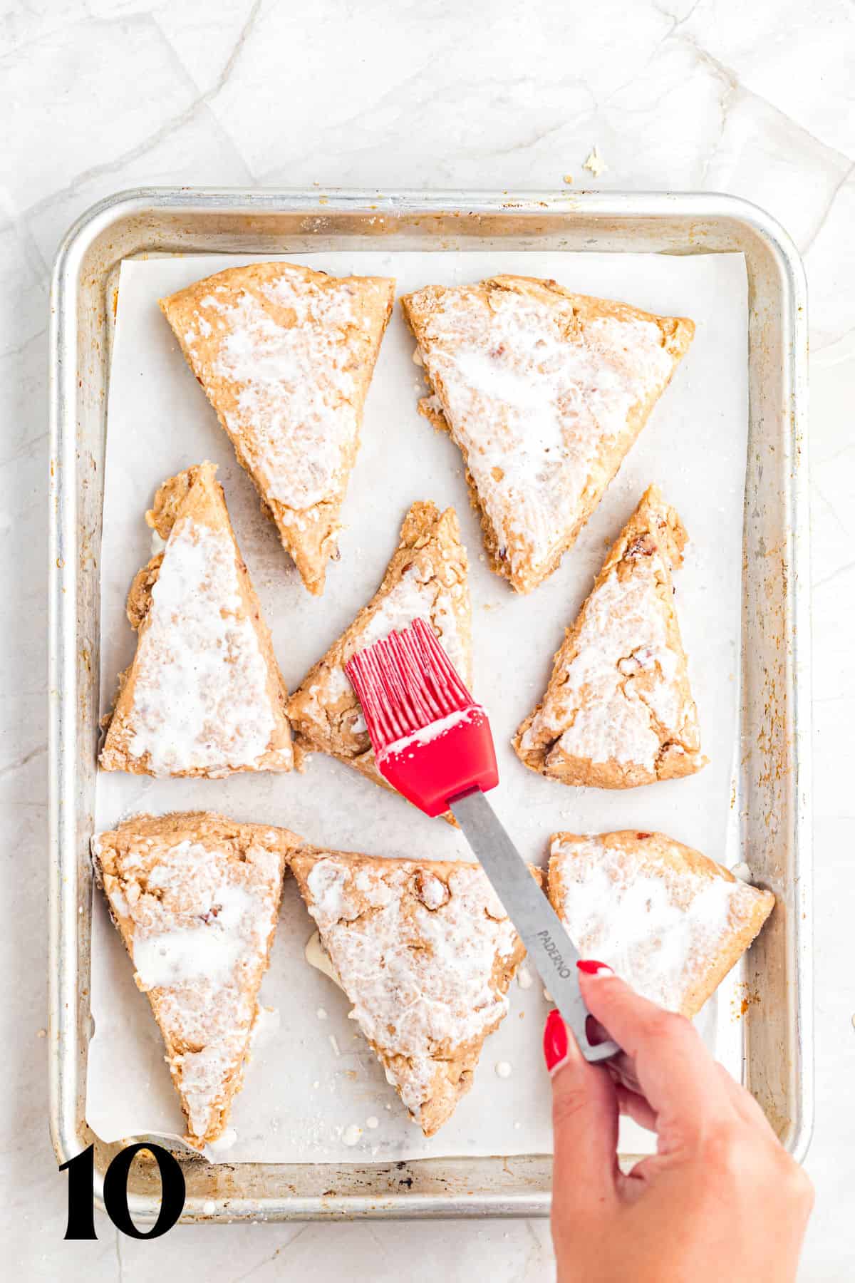 How to Make Pecan Maple Scones - Step 10 - Brushing with cream.