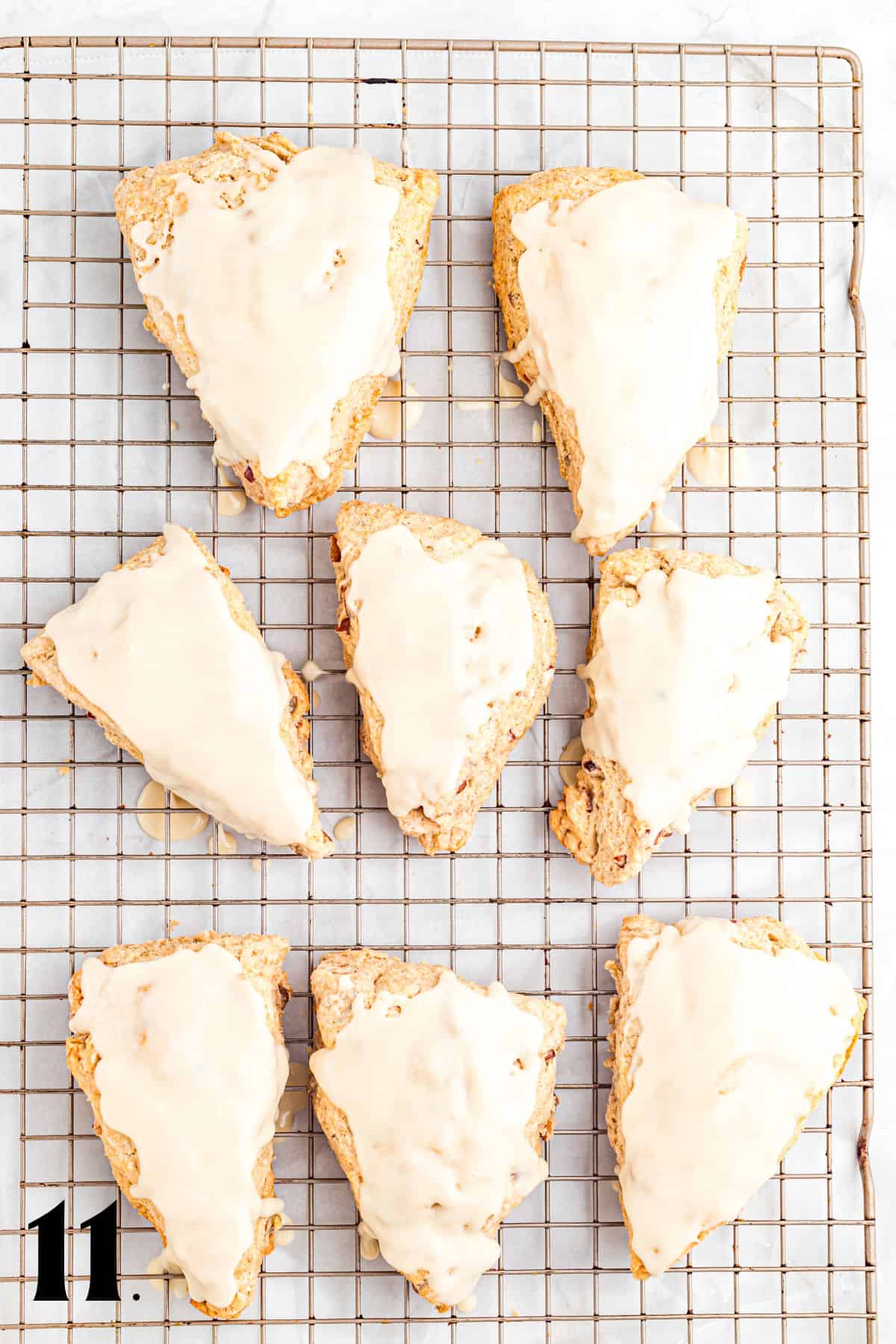 How to Make Pecan Maple Scones - Step 11 with glaze on top.