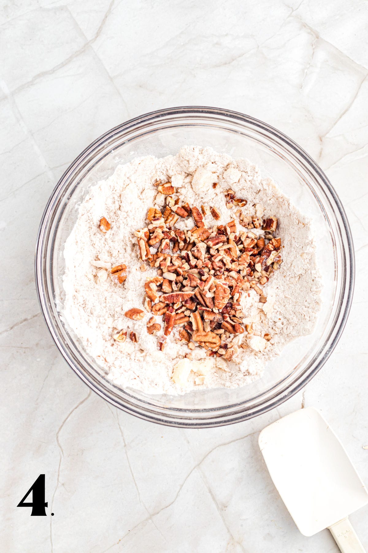 How to Make Pecan Maple Scones - Step 4 adding chopped nuts to dough base.