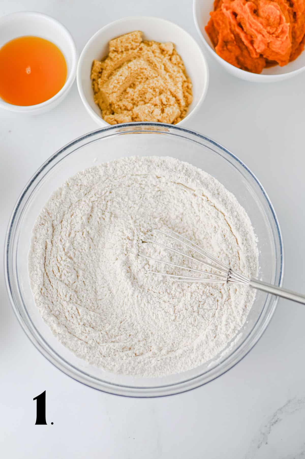 How to Make Pumpkin Coffee Cake Step 1 - blending dry ingredients in bowl.