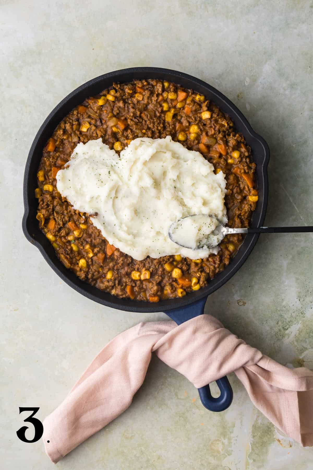 How to Make Shepherd's Pie - Step 3 - adding instant potatoes on top.