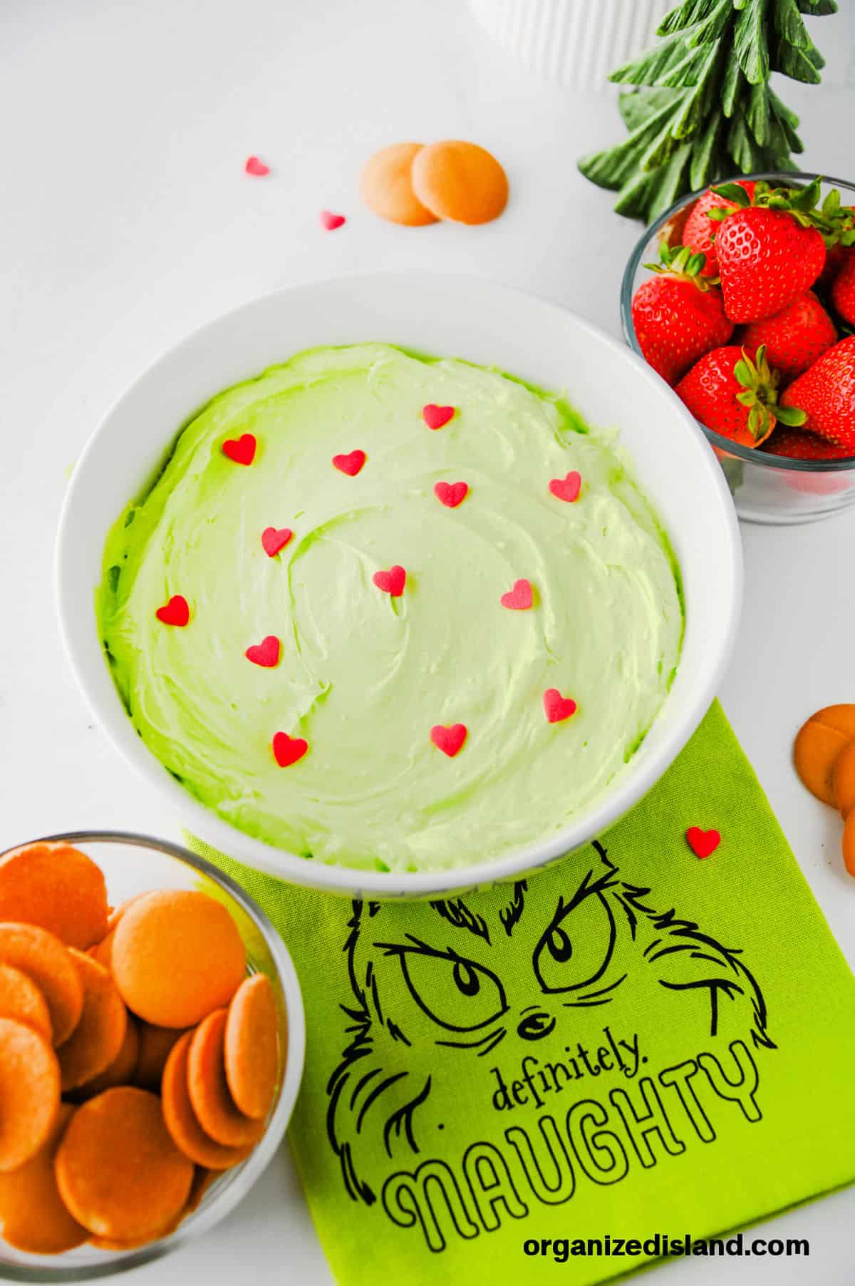 Grinch Dessert Dip - green dip in bowl with candy hearts.