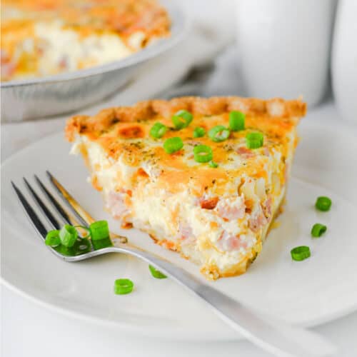 Ham and Cheese Quiche on plate with fork.