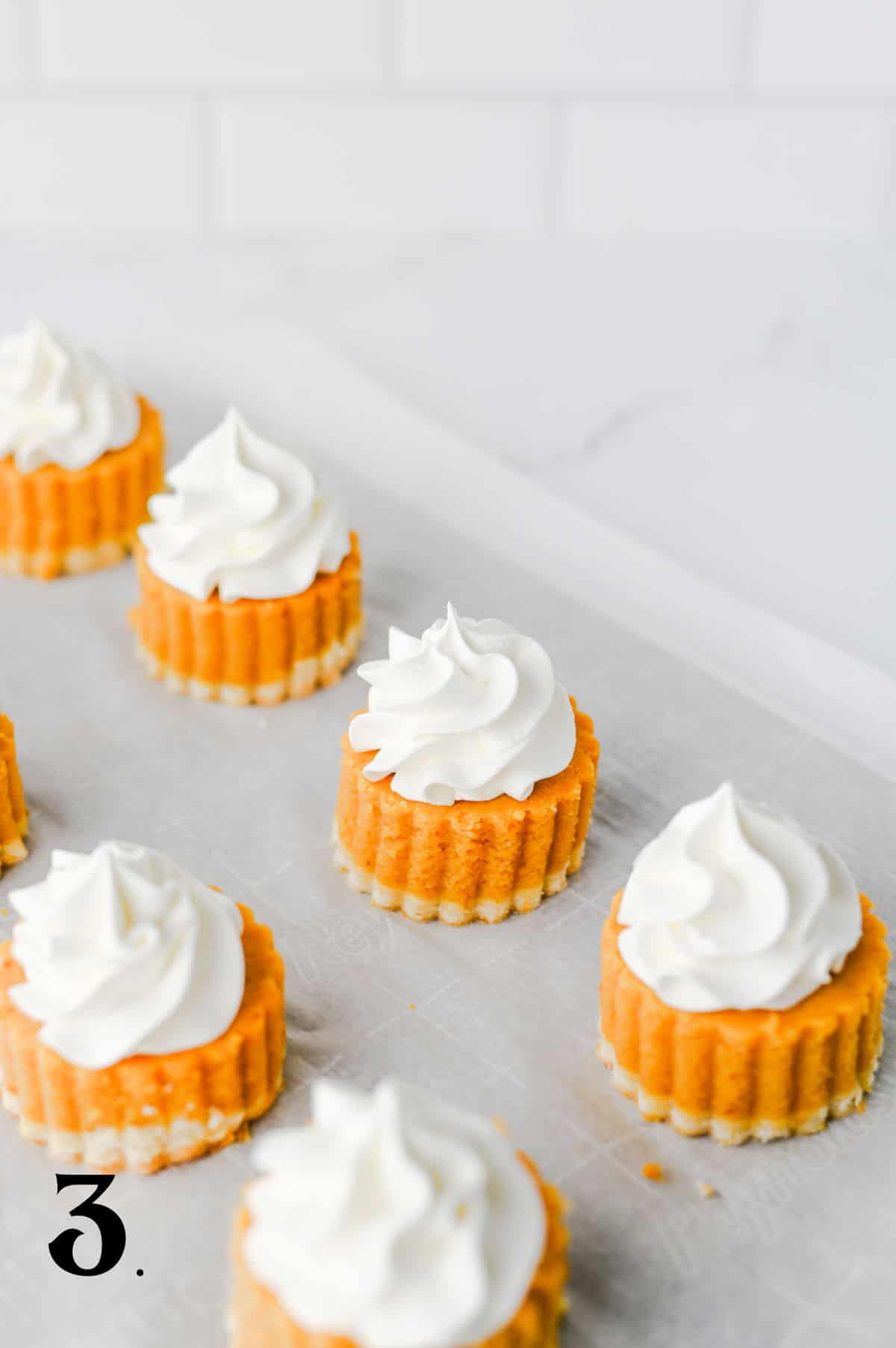 How to Make Pumpkin Pie Bites Step 3 - top with cream.
