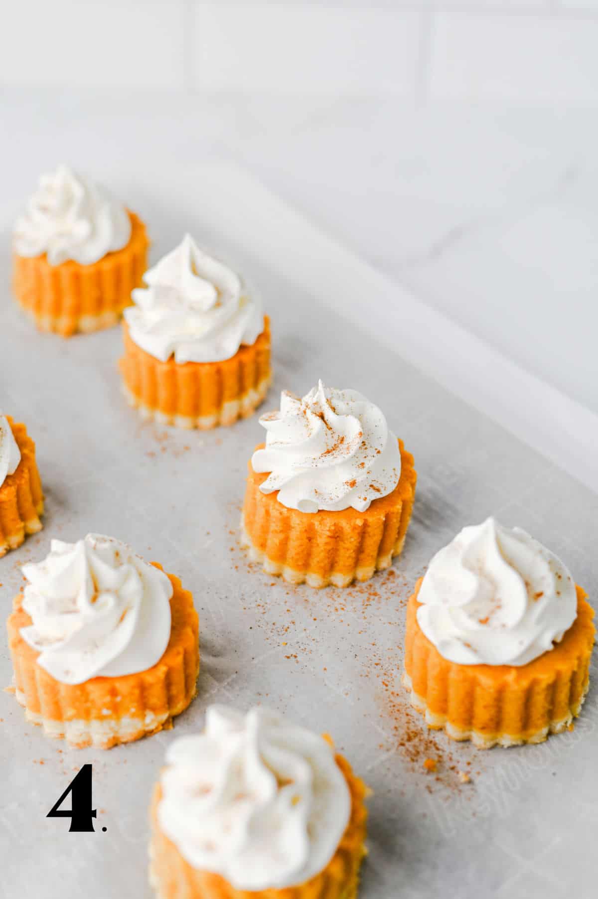 How to Make Pumpkin Pie Bites Step 4 - top with whipped cream.