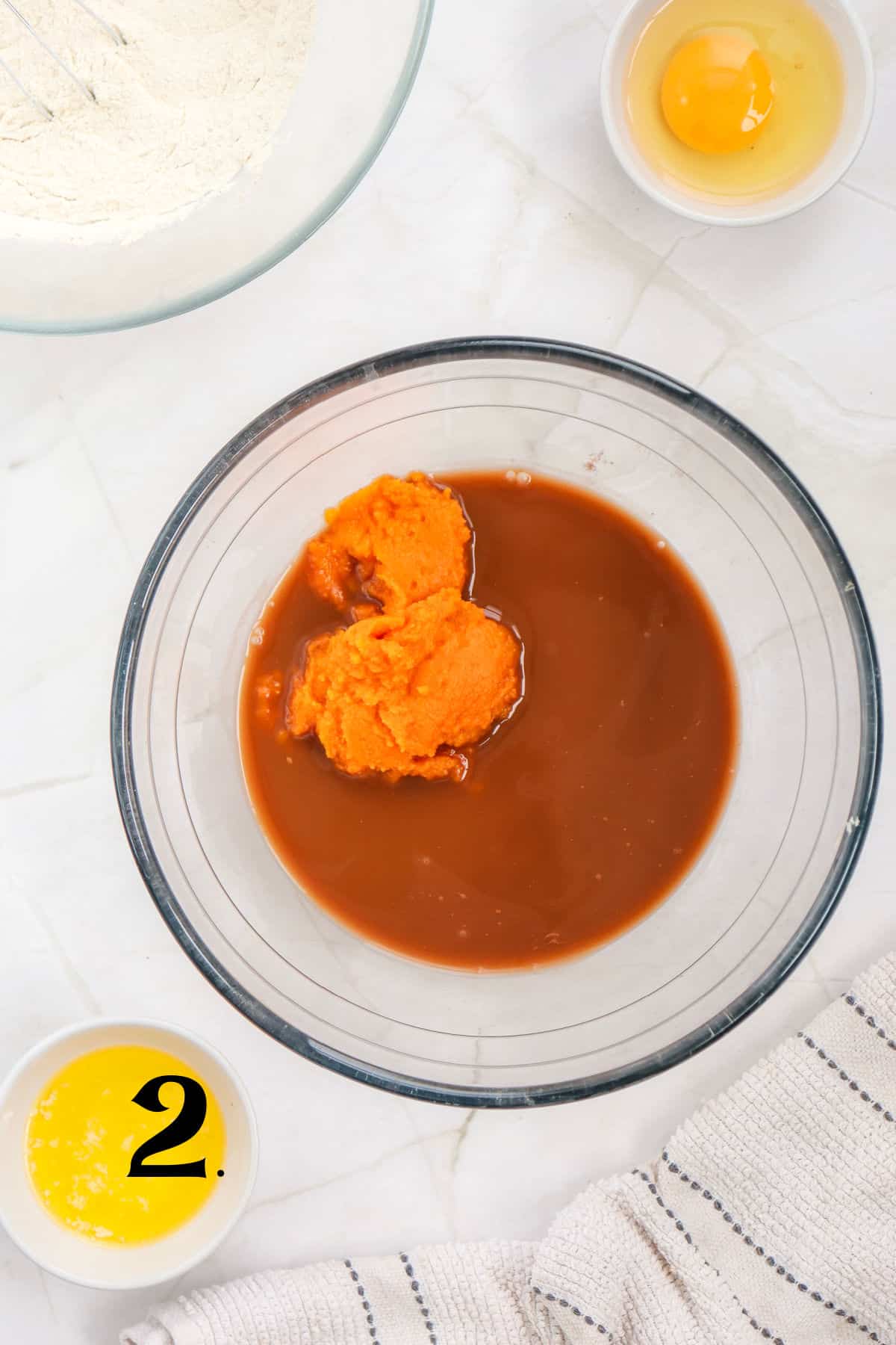 How to Make Pumpkin Waffles Step 2 -mixing pumpkin in bowl.