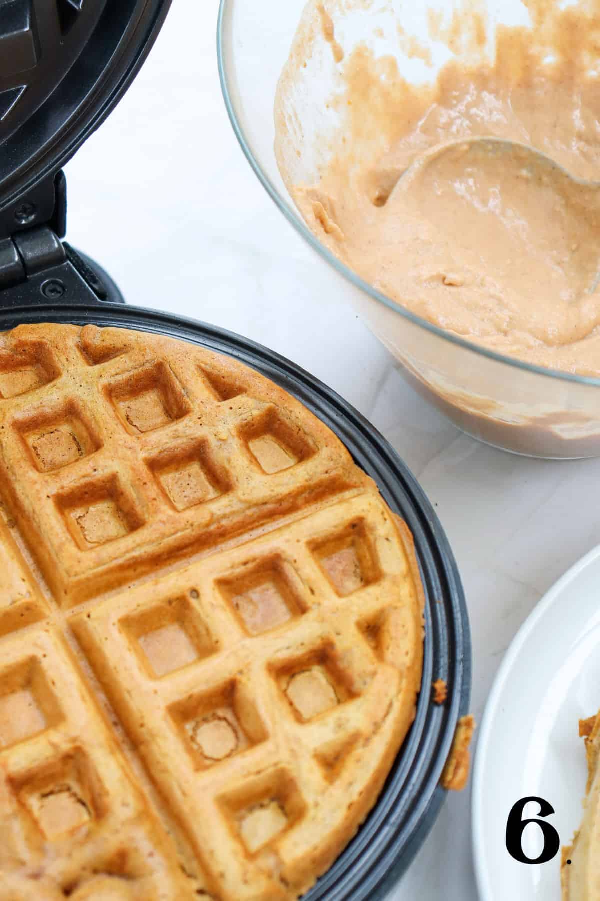 How to Make Pumpkin Waffles Step 6 - fully cooked waffle in waffle iron.