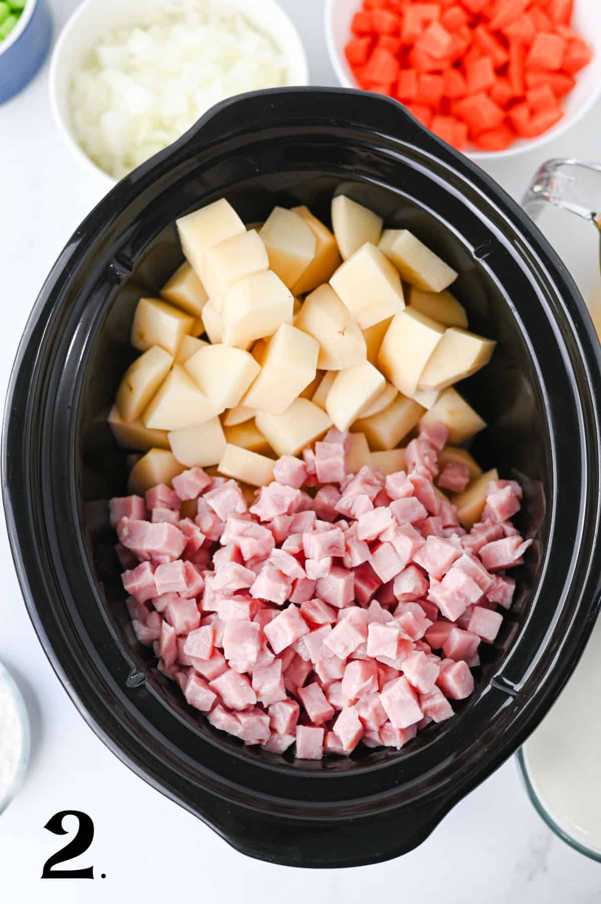 How to Make Slow Cooker Ham and Potato Soup Step 2 - adding ham to slow cooker.