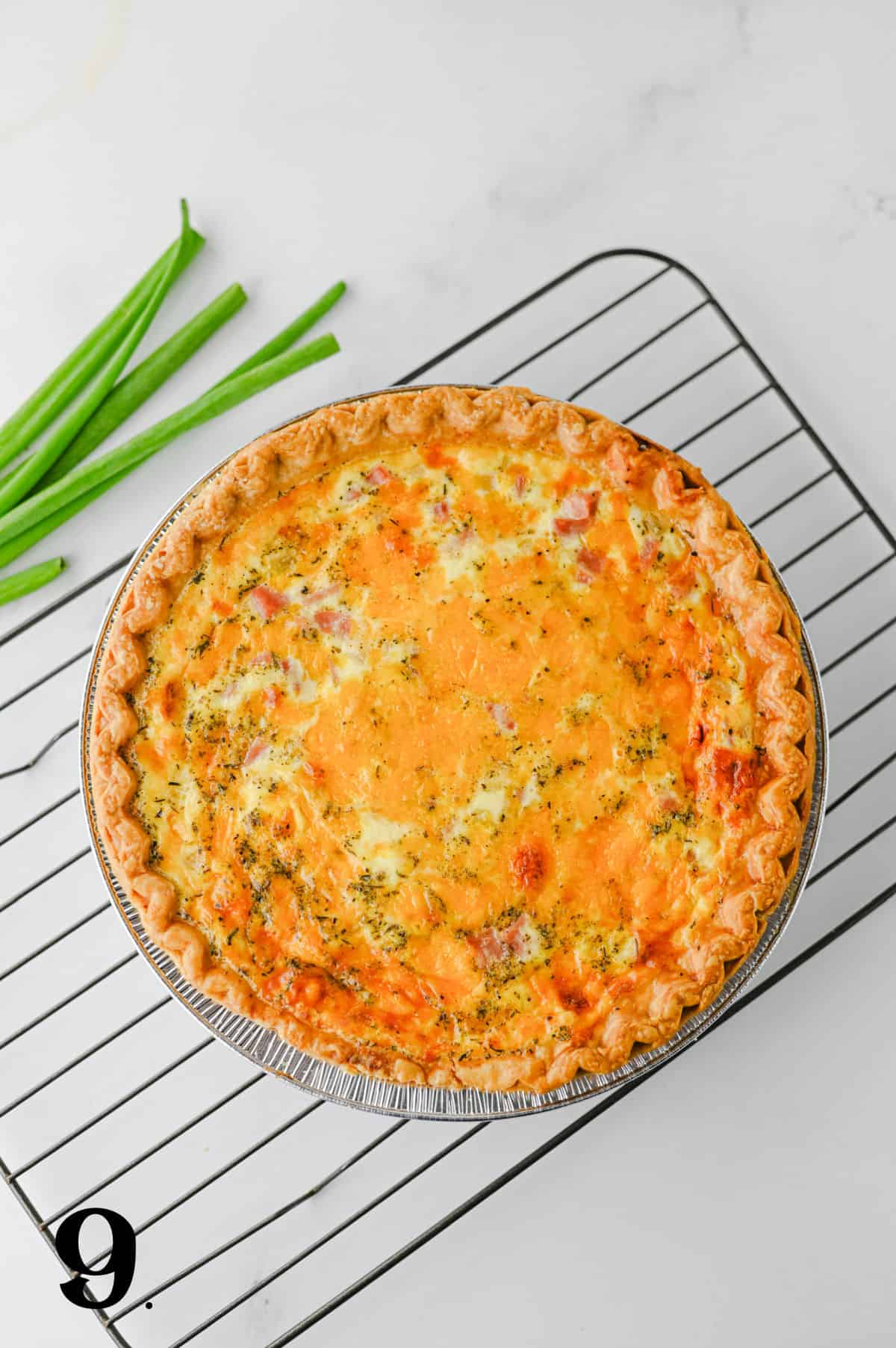 How to make a Ham and Cheese Quiche Step 9 - quiche cooling on rack.