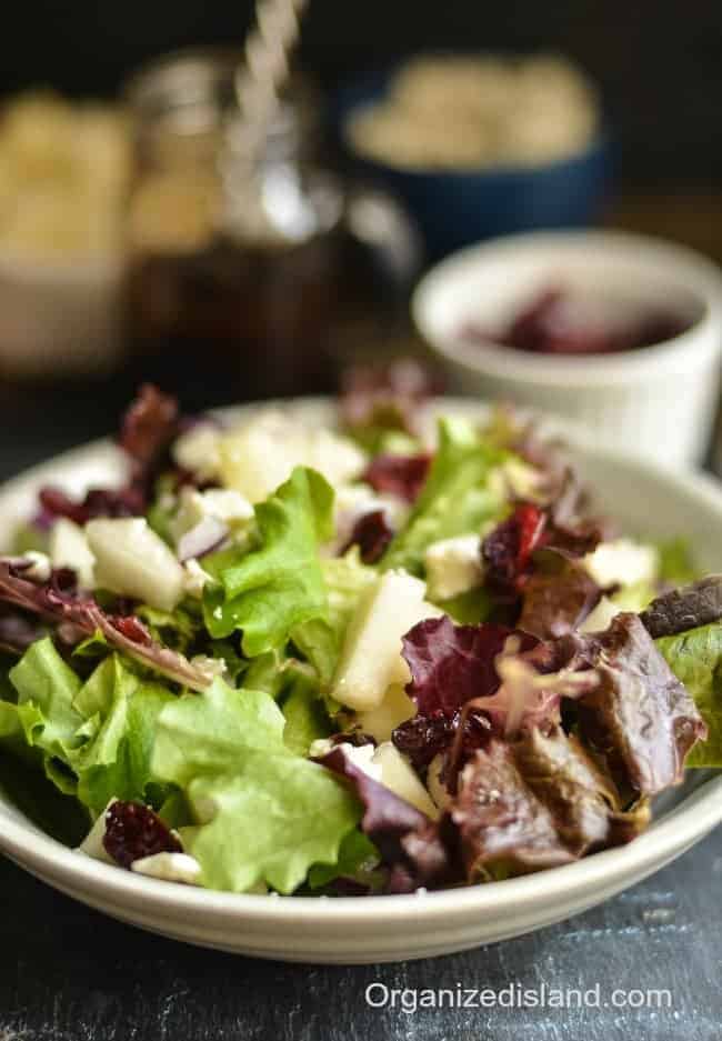 Grab a bag of greens and add some cranberries, pears and feta cheese to create this wonderful fall Pear salad with Feta Cheese.