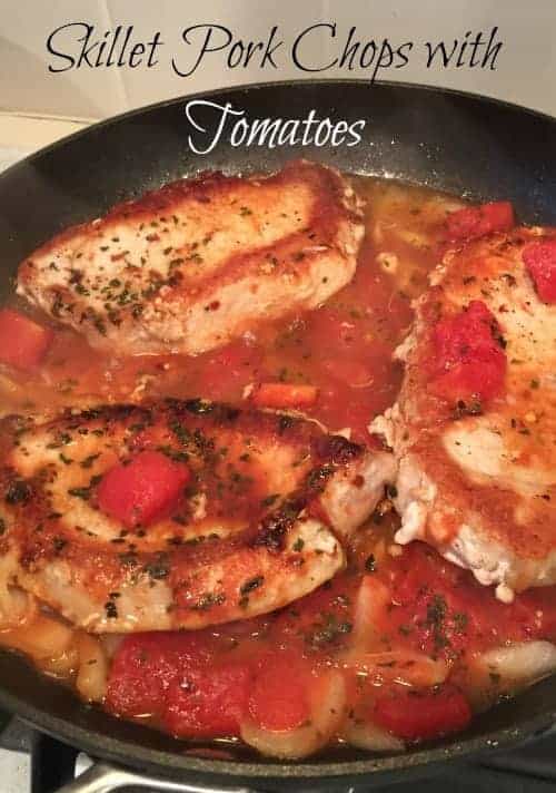 These saucy skillet pork chops with tomatoes make an easy dinner idea! Made on your stovetop!
