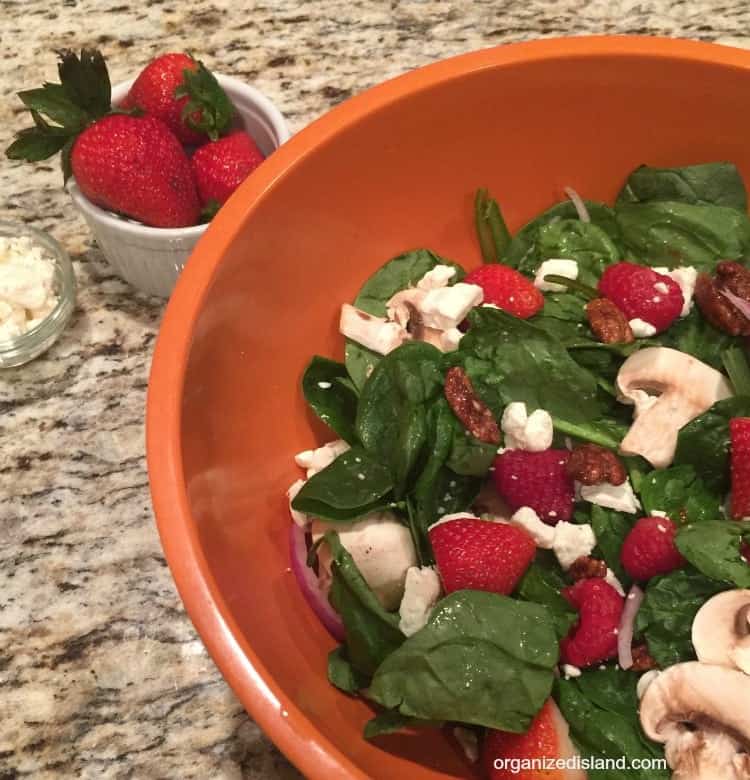 When you want a light salad, this Spinach Strawberry Feta Salad is great spring or summer salad! WIth mushrooms and candied pecans, it is sweet and tangy!