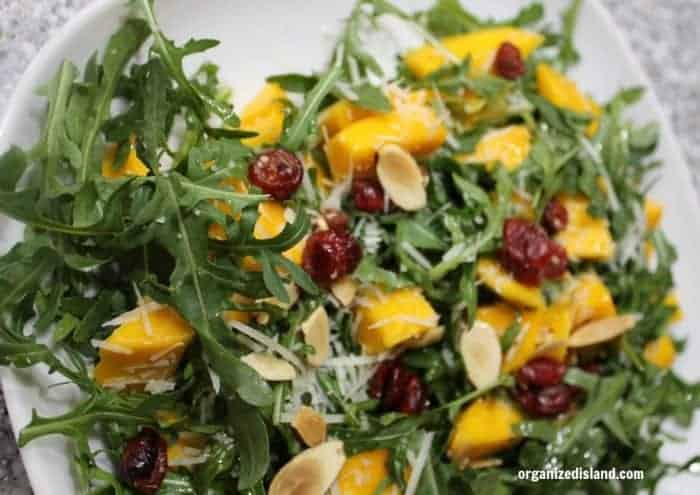 Simple and easy Mango Arugula salad recipe that is perfect for spring and summer!